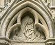 Panel 08:06 - Robed male figure kneeling before a small dog-like monster's backside